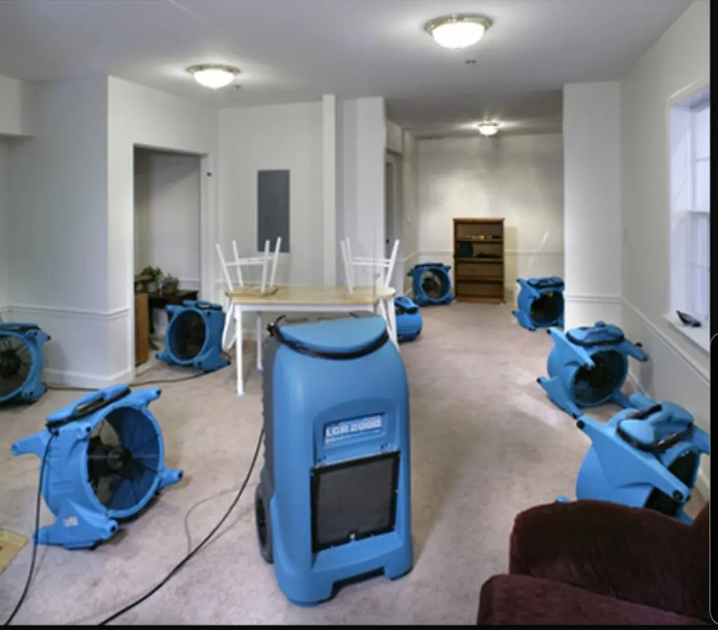 Air movers and dehumidifier setup for Water Damage Restoration in Janesville